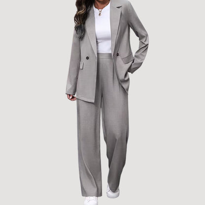 Women's tailored pant suit by Homixa featuring a double-breasted blazer and pleated wide-leg pants, suitable for professional wear.