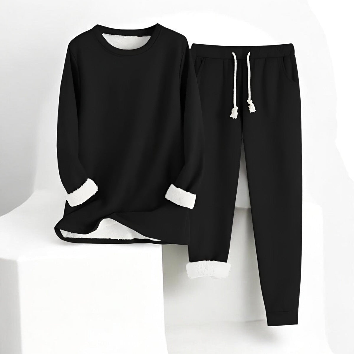 Women’s thermal fleece two-piece set by Homixa featuring a cozy sweater and drawstring pants for warmth and comfort.