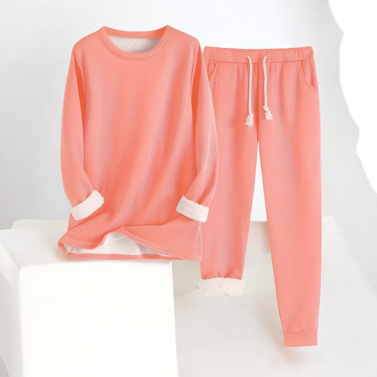 Women’s thermal fleece two-piece set by Homixa featuring a cozy sweater and drawstring pants, ideal for cold weather.
