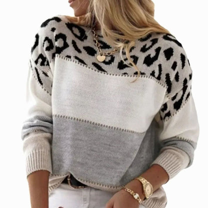 Women's cashmere blend turtleneck sweater with a color-block leopard pattern, featuring a cozy and stylish design.