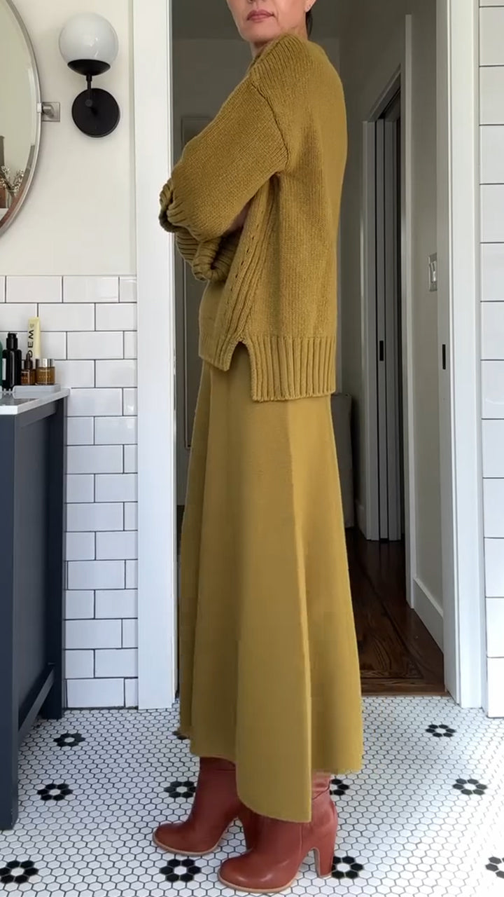 Women's two-piece set featuring an oversized soft-knit sweater and flowing maxi skirt by Homixa, styled for casual comfort.