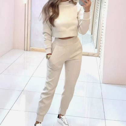 Homixa women's two-piece track suit with cropped crew-neck sweater and high-waist joggers, casual athletic outfit.