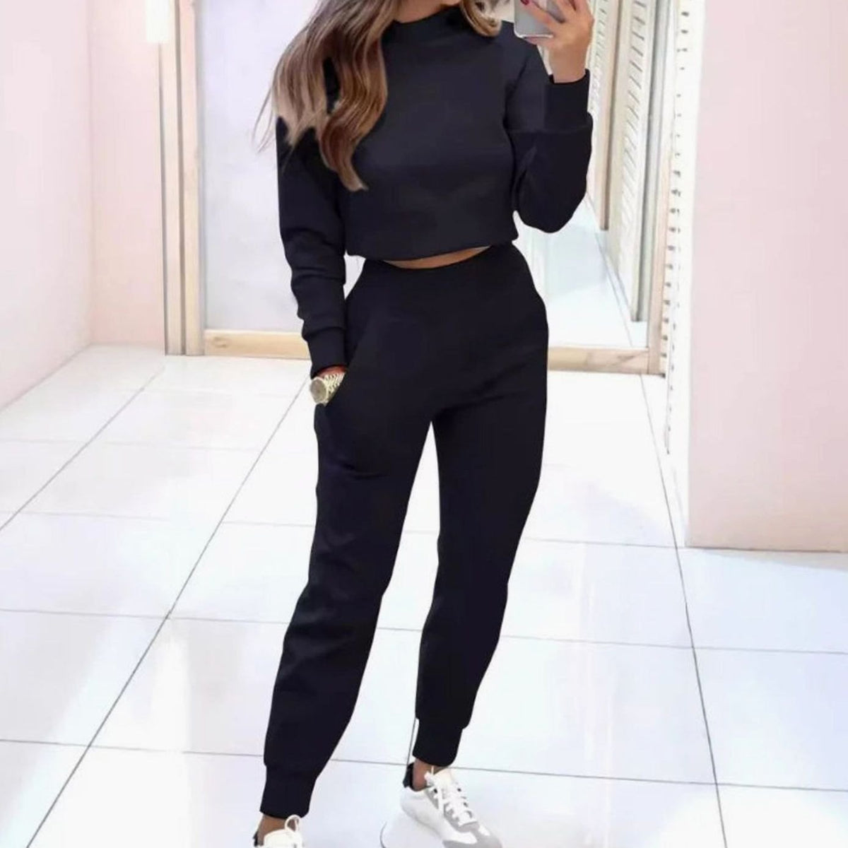 Homixa women's two-piece track suit featuring a cropped crew-neck sweater and high-waist joggers, perfect for active casual wear.