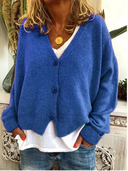 Women's Homixa V-neck button-front knit cardigan with long sleeves in solid colors, displayed draped on a hanger.