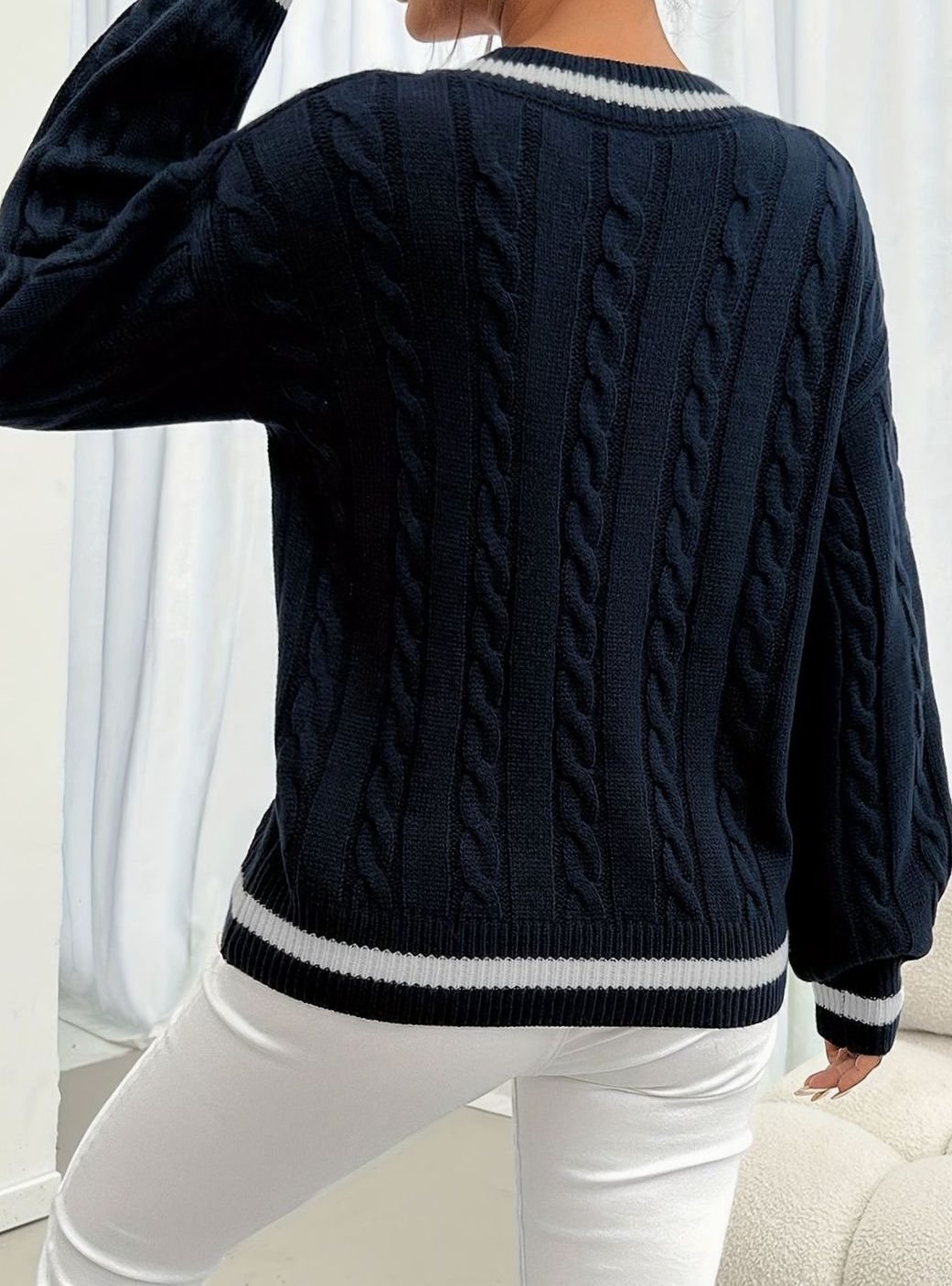 Women's V-neck cable sweater by Homixa featuring drop-shoulder design and contrast trim, showcasing a cozy, stylish knit sweater.