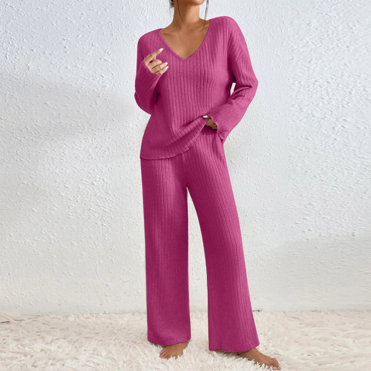 Women’s V-neck knit two-piece set from Homixa featuring a long-sleeve top and elastic-waist pants, styled for casual wear.