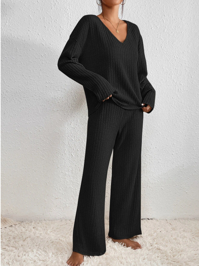 Women’s V-neck knit two-piece set by Homixa, featuring a long-sleeve top and elastic-waist pants, shown in a cozy, stylish outfit.