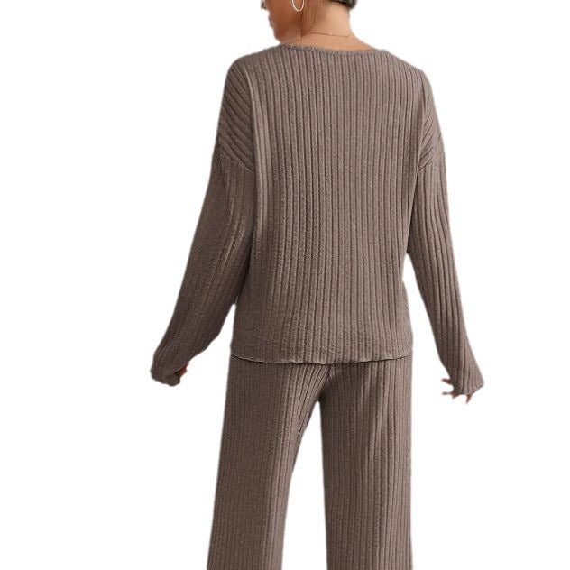 Women’s V-neck knit two-piece set by Homixa featuring a long-sleeve top and elastic-waist pants, styled for casual wear.