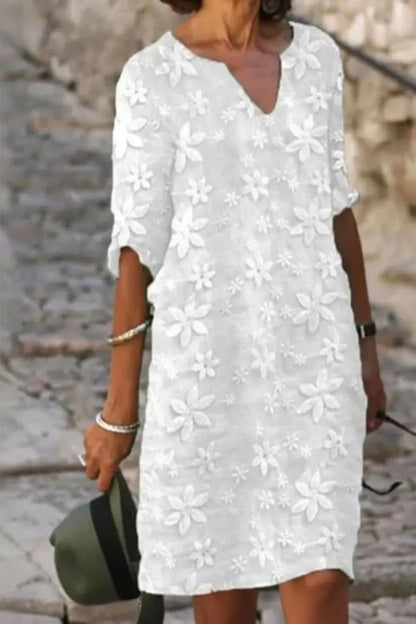 Women's V-neck midi cocktail dress by Homixa with delicate floral lace overlay, perfect for elegant occasions.