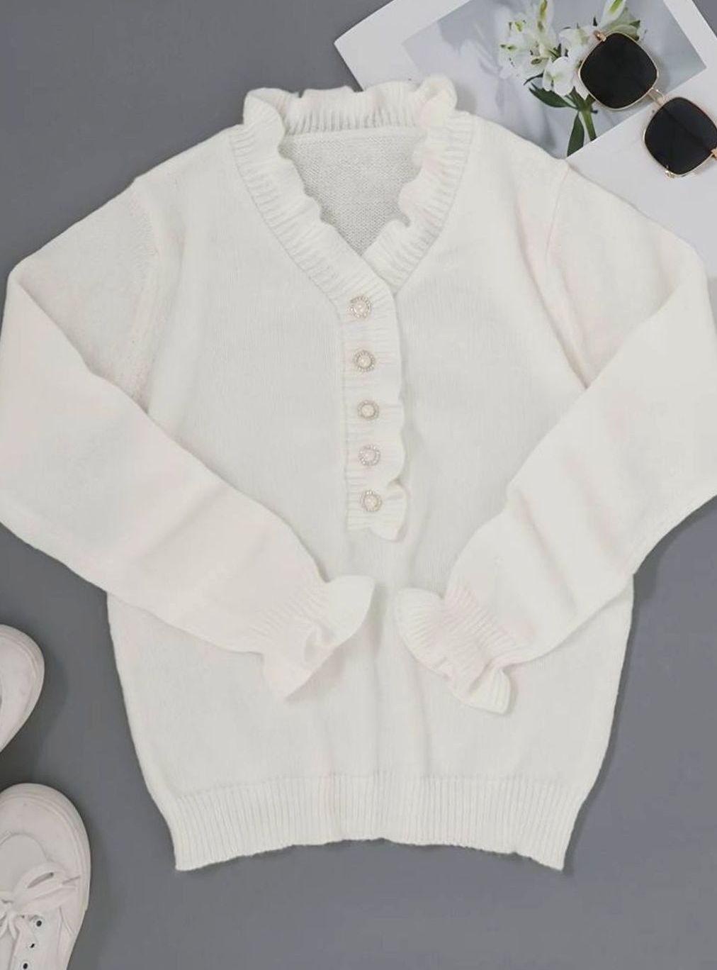 Homixa women's V-neck sweater with pearl buttons and ruffle trim at neck and cuffs, showcasing elegant cardigan design.