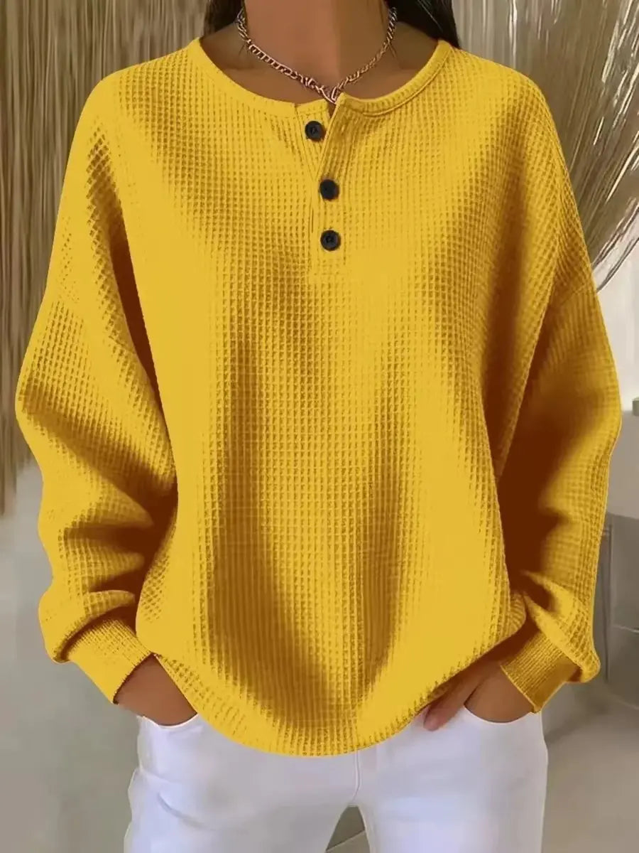 Women's waffle-knit Henley pullover by Homixa featuring long sleeves and a three-button placket, styled for casual wear.