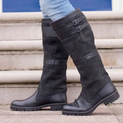 Women's waterproof country knee-high boots by Homixa with double buckles, pull-on design, and two-tone upper for rugged style.