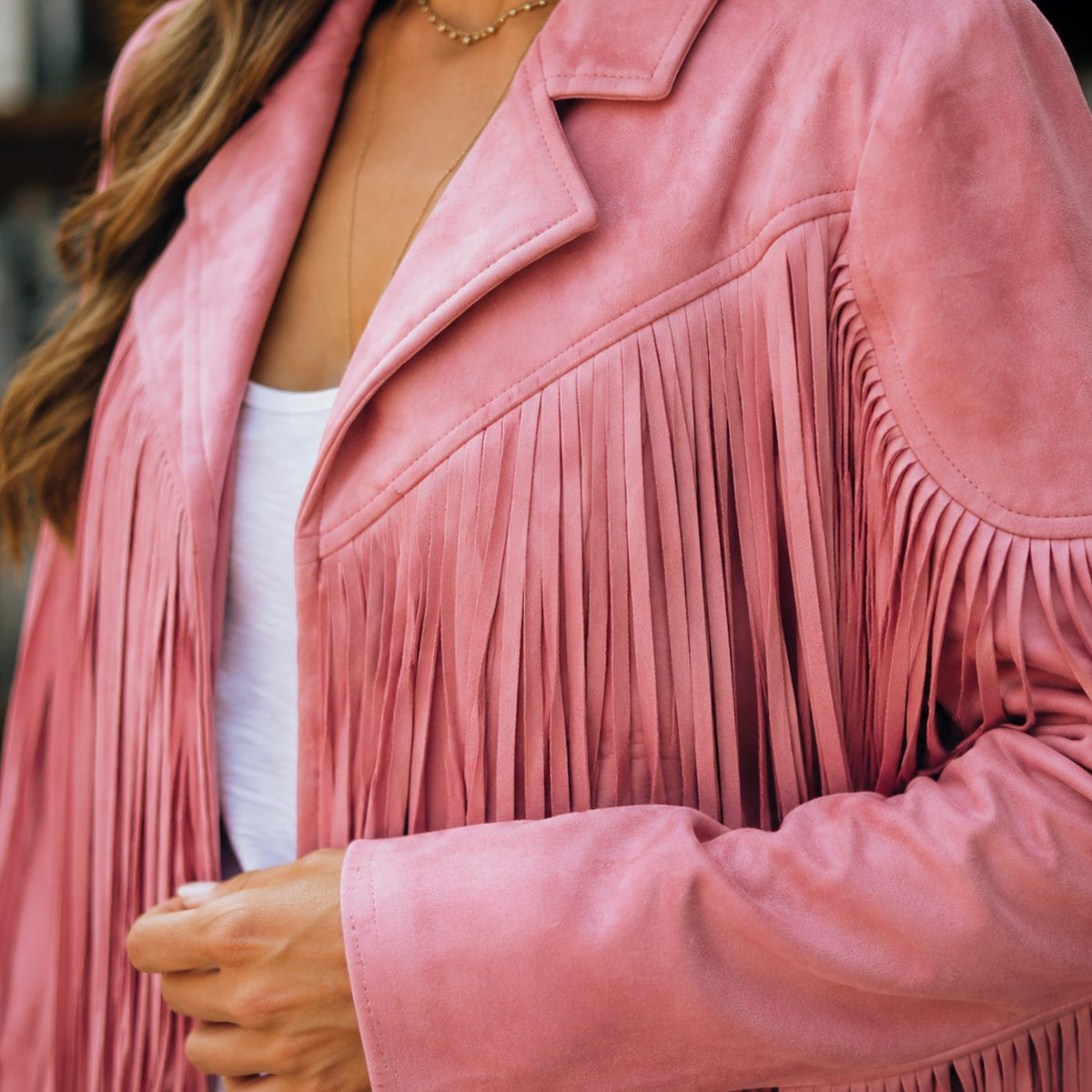 Women's Western Fringe Jacket by Homixa, cropped faux suede with fringe details and notched lapels, styled on a model.