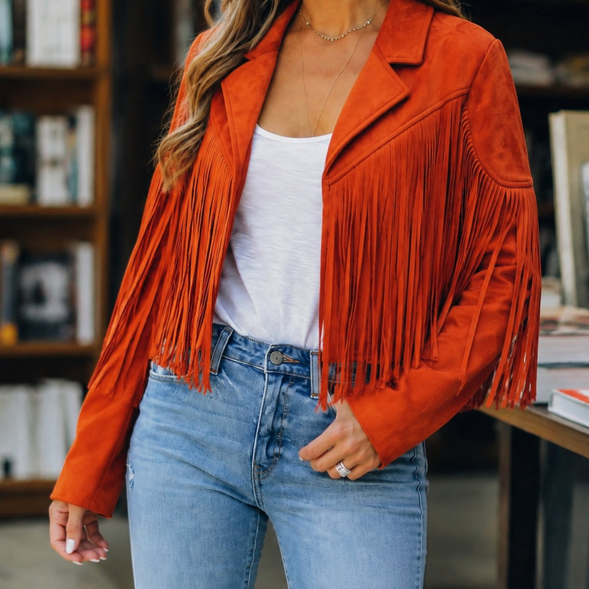 Women's Western Fringe Jacket by Homixa, cropped faux suede with notched lapels and fringe detailing, styled for a western look.