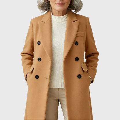 Women’s wool-blend coat by Homixa with flap pockets, notched lapels, and double-breasted front, shown hanging on a wooden hanger.