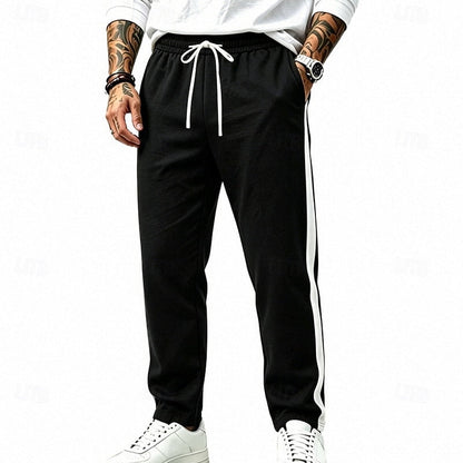 Harper & Wells Damian relaxed side-stripe sweatpants in dark gray, featuring comfortable fit and stylish side stripe detail.